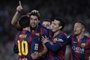 Barcelona's Uruguayan forward Luis Suarez (C) is congratulated by his teammate Barcelona's Argentinian forward Lionel Messi (L) and Barcelona's forward Pedro Rodriguez  after scoring during the Spanish league football match FC Barcelona vs Levante UD at the Camp Nou stadium in Barcelona on February 15, 2015.   AFP PHOTO/ JOSEP LAGO