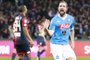 Napoli's Argentinian-French forward Gonzalo Higuain celebrates after scoring during the Italian Serie A football match SSC Napoli vs Genoa CFC on March 20, 2016 at the San Paolo stadium in Naples