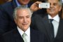 Brazilian acting President Michel Temer gestures during the inauguration ceremony of the new ministers at Planalto Palace, in Brasilia, on May 12, 2016.