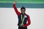  US gymnast Simone Biles celebrates with her gold medal on the podium after the womens individual all-around final of the Artistic Gymnastics at the Olympic Arena during the Rio 2016 Olympic Games in Rio de Janeiro on August 11, 2016. US gymnast Simone Biles won the event ahead of her compatiot Alexandra Raisman and Russias Aliya Mustafina.Thomas COEX / AFPEditoria: SPOLocal: Rio de JaneiroIndexador: THOMAS COEXSecao: gymnasticsFonte: AFPFotógrafo: STF