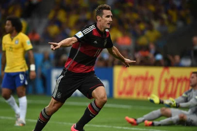 491932073Germanys forward Miroslav Klose reacts after scoring during the semi-final football match between Brazil and Germany at The Mineirao Stadium in Belo Horizonte on July 8, 2014, during the 2014 FIFA World Cup . AFP PHOTO / PEDRO UGARTEEditoria: SPOLocal: Belo HorizonteIndexador: PEDRO UGARTESecao: sports eventFonte: AFPFotógrafo: STF