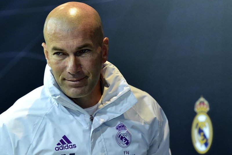 Real Madrid's French coach Zinedine Zidane leaves after giving a press conference at Valdebebas Sport City in Madrid on January 3, 2017, on the eve of the Spanish Copa del Rey (King's Cup) match Real Madrid CF vs Sevilla FC. / AFP PHOTO / GERARD JULIEN