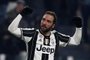 Juventus forward Gonzalo Higuaín from Argentina celebrates after scoring during the Italian Serie A football match Juventus Vs Bologna on January 8, 2017 at the Juventus Stadium in Turin. MARCO BERTORELLO / AFP