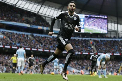 Leicester Citys Algerian midfielder Riyad Mahrez celebrates scoring his teams second goal during the English Premier League football match between Manchester City and Leicester City at the Etihad Stadium in Manchester, north west England, on February 6, 2016.