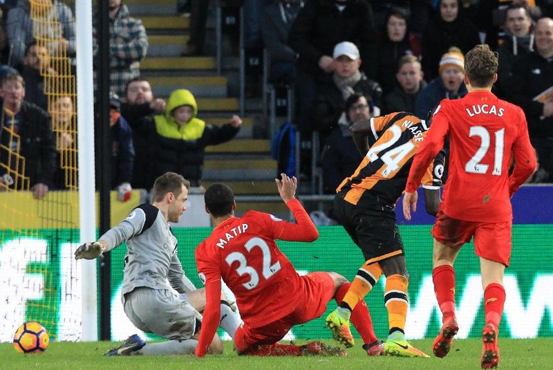 FBL-ENG-PR-HULL-LIVERPOOLHull Citys Senegalese striker Oumar Niasse (2nd R) scores their second goal past Liverpools Belgian goalkeeper Simon Mignolet (L) during the English Premier League football match between Hull City and Liverpool at the KCOM Stadium in Kingston upon Hull, north east England on February 4, 2017. Hull won the game 2-0.Lindsey PARNABY / AFP