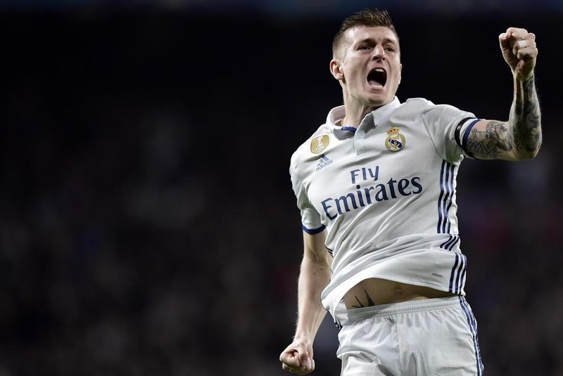 Real Madrid's German midfielder Toni Kroos celebrates a goal during the UEFA Champions League round of 16 first leg football match Real Madrid CF vs SSC Napoli at the Santiago Bernabeu stadium in Madrid on February 15, 2017. JAVIER SORIANO / AFP