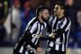 Brazils Botafogo player João Paulo (L) celebrates with teammate Rodrigo Pimpão after scoring against Uruguays Nacional during their Copa Libertadores football match at the Parque Central stadium in Montevideo on July 6, 2017.    / AFP PHOTO / MIGUEL ROJO