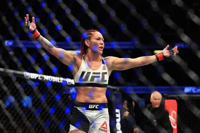 Cris Cyborg of Brazil reacts to defeating Tonya Evinger during their Featherweight Title fight at UFC 214 at Honda Center on July 29, 2017 in Anaheim, California. Sean M. Haffey/Getty Images/AFP 