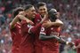 Liverpools Senegalese midfielder Sadio Mane (R) celebrates with teammates after scoring their second goal during the English Premier League football match between Liverpool and Arsenal at Anfield in Liverpool, north west England on August 27, 2017. / AFP PHOTO / Anthony Devlin / RESTRICTED TO EDITORIAL USE. No use with unauthorized audio, video, data, fixture lists, club/league logos or live services. Online in-match use limited to 75 images, no video emulation. No use in betting, games or single club/league/player publications.  / 