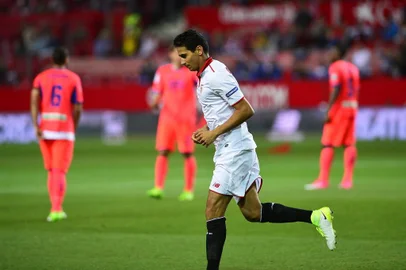 Sevilla's Brazilian midfielder Ganso celebrates after scoring during the Spanish league football match Sevilla FC vs Granada FC at the Ramon Sanchez Pizjuan stadium in Sevilla on April 21, 2017. / AFP PHOTO / CRISTINA QUICLER