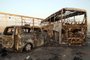A general view show burnt out vehicles after gunmen and suicide car bombers killed dozens of people in two assaults claimed by Islamic State (IS) group jihadists near the southern Iraqi city of Nasiriyah on September 14, 2017. 
The attackers struck at midday, opening fire on a restaurant before getting into a car and blowing themselves up at a nearby security checkpoint, officials said. / AFP PHOTO / Haidar HAMDANI