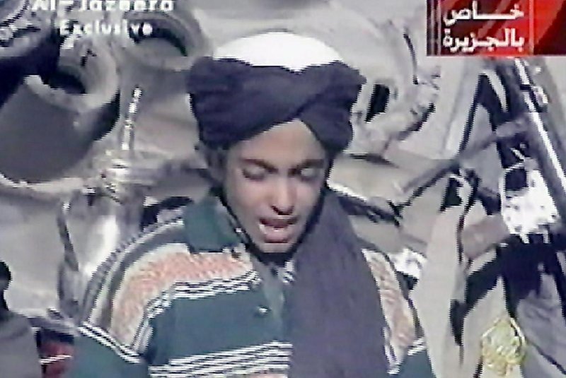 (FILES) This file photo taken on November 7, 2001 shows Hamza, who appears to be the youngest son of prime terror suspect Saudi born Osama bin Laden, reciting a poem extolling Kabul and Mullah Mohammad Omar, supreme leader of Afghanistans Taliban rulers, in this frame grab taken from the Qatar based al-Jazeera satellite news channel.  
The photomontage, which was published on September 11, 2017 by Al-Qaeda for the 16th anniversary of the September 11, 2001 attacks shows the face of Osama bin Laden in the twin towers next to his son Hamza. 

 / AFP PHOTO / AL-JAZEERA / STRINGER