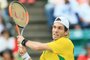 Guilherme Clezar of Brazil hits a return to Yuichi Sugita of Japan during the first tennis match of the Davis Cup World Group playoff between Japan and Brazil in Osaka on September 15, 2017.  / AFP PHOTO / JIJI PRESS / STR / Japan OUT