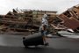 Aftermaths after hurricane Maria hit the Caribbean islands

A woman pulls a trash can past a destroyed home as Hurricane Maria hits Puerto Rico in Fajardo, on September 20, 2017.
Maria made landfall on Puerto Rico, pummeling the US territory after already killing at least two people on its passage through the Caribbean. The US National Hurricane Center warned of large and destructive waves as Maria came ashore near Yabucoa on the southeast coast. / AFP PHOTO / Ricardo ARDUENGO

Editoria: DIS
Local: Fajardo
Indexador: RICARDO ARDUENGO
Secao: disaster (general)
Fonte: AFP
Fotógrafo: STR