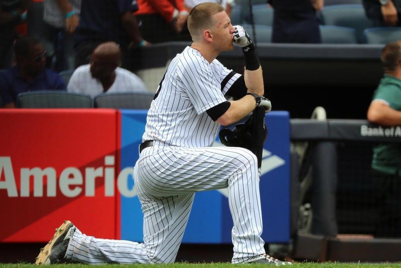 NEW YORK, NY - SEPTEMBER 20: Todd Frazier #29 of the New York Yankees reacts after a child was hit by a foul ball off his bat in the fifth inning against the Minnesota Twins on September 20, 2017 at Yankee Stadium in the Bronx borough of New York City.   Abbie Parr/Getty Images/AFP