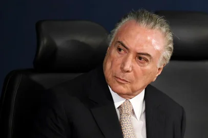 Brazilian President Michel Temer attends the inauguration of the country's new Attorney General, Raquel Dodge, in Brasilia on September 18, 2017.
Dodge took over to oversee an avalanche of corruption investigations, including against President Michel Temer, and promised that no one would be "above the law." Dodge replaced the hard hitting Rodrigo Janot who last week rounded off his dramatic term in office by charging Temer with racketeering and obstruction of justice. / AFP PHOTO / EVARISTO SA