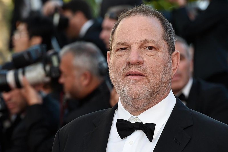(FILES) This file photo taken on May 22, 2015 shows US producer Harvey Weinstein arriving for the screening of the film The Little Prince at the 68th Cannes Film Festival in Cannes.    Weinstein was fired from his film studio the Weinstein Company on October 8, 2017, following reports that he sexually harassed women over several decades, according to US media. / AFP PHOTO / LOIC VENANCE