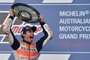Honda rider Marc Marquez of Spain celebrates his victory on the podium at the end of the Australian MotoGP Grand Prix at Phillip Island on October 22, 2017. / AFP PHOTO / PETER PARKS / -- IMAGE RESTRICTED TO EDITORIAL USE - STRICTLY NO COMMERCIAL USE --