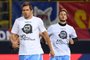 Lazios midfielder from Bosnia-Herzegovina Senad Lulic (L) wears a t-shirt showing an image of holocaust victim Anne Frank, during the warm up prior the Italian Serie A football match Bologna vs Lazio on October 25, 2017 at the Renato-DallAra stadium in Bologna. Emotions were still running high in Italy, days after Lazio fans posted anti-semitic photos of Anne Frank in a Roma jersey in the stands of the Stadio Olimpico.
The Italian football federation announced that there will be a minutes reflection on the Holocaust before every match and a passage read from The Diary of Anne Frank. At the same time referees and captains will hand out copies of the diary and Italian Jewish writer Primo Levis memoir If This Is A Man.
 / AFP PHOTO / Gianni SCHICCHI