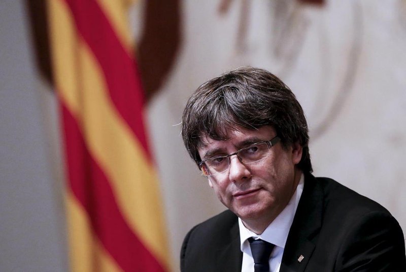 Catalan regional government president Carles Puigdemont attends a regional government meeting at the Generalitat Palace in Barcelona on October 10, 2017. 
Spains worst political crisis in a generation will come to a head as Catalonias leader could declare independence from Madrid in a move likely to send shockwaves through Europe.  / AFP PHOTO / PAU BARRENA