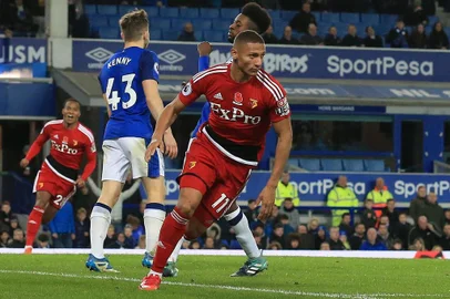 Watfords Brazilian striker Richarlison de Andrade celebrates scoring the opening goal during the English Premier League football match between Everton and Watford at Goodison Park in Liverpool, north west England on November 5, 2017. / AFP PHOTO / Lindsey PARNABY / RESTRICTED TO EDITORIAL USE. No use with unauthorized audio, video, data, fixture lists, club/league logos or live services. Online in-match use limited to 75 images, no video emulation. No use in betting, games or single club/league/player publications.  / 