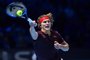 Germanys Alexander Zverev returns to US player Jack Sock during their mens singles round-robin match on day five of the ATP World Tour Finals tennis tournament at the O2 Arena in London on November 16 2017. / AFP PHOTO / Glyn KIRK