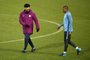 Manchester Citys Spanish manager Pep Guardiola (L) gestures as he talks with Manchester Citys Brazilian midfielder Fernandinho during a team training session at the City Football Academy in Manchester, north west England on November 20, 2017, on the eve of their UEFA Champions League Group F match against Feyenoord. / AFP PHOTO / Oli SCARFF