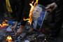  

A portrait of US President Donald Trump burns during a demonstration in the capital Tehran on December 11, 2017 to denounce his declaration of Jerusalem as Israels capital. / AFP PHOTO / ATTA KENARE

Editoria: WAR
Local: Tehran
Indexador: ATTA KENARE
Secao: diplomacy
Fonte: AFP
Fotógrafo: STF
