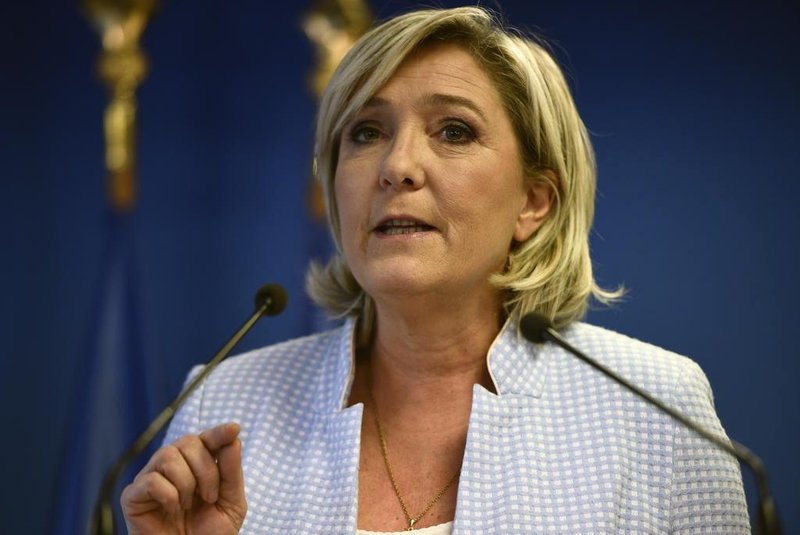 President of the French far-right party and presidential candidate for the 2017 French Presidential elections Marine Le Pen delivers a speech during a press conference on november 9, 2016 in the party headquarters inNanterre, near Paris, following the victory by US Republican candidate Donald Trump in US presidential elections. Marine Le Pen said on November 9, 2016 that Donald Trumps election to the US presidency was good news for France in a speech. Donald Trump has stunned America and the world,  riding a wave of populist resentment to defeat Hillary Clinton in the race to become the 45th president of the United States. The Republican mogul defeated his Democratic rival, plunging global markets into turmoil and casting the long-standing global political order, which hinges on Washingtons leadership, into doubt.
Martin BUREAU / AFP