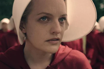 THE HANDMAIDS TALE -- The drama series, based on the award-winning, best-selling novel by Margaret Atwood, is the story of life in the dystopia of Gilead, a totalitarian society in what was formerly part of the United States. Facing environmental disasters and a plunging birthrate, Gilead is ruled by a fundamentalist regime that treats women as property of the state. As one of the few remaining fertile women, Offred (Elisabeth Moss) is a Handmaid in the Commanders household, one of the caste of women forced into sexual servitude as a last desperate attempt to repopulate a devastated world. In this terrifying society where one wrong word could end her life, Offred navigates between Commanders, their cruel Wives, domestic Marthas, and her fellow Handmaids – where anyone could be a spy for Gilead – all with one goal: to survive and find the daughter that was taken from her. Offred (Elisabeth Moss), shown. (Photo by: Take Five/Hulu)