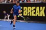 Rafael Nadal of Spain hits a forehand return during his Tie Break Tens tennis tournament match against Lleyton Hewitt of Australia in Melbourne on January 10, 2018. / AFP PHOTO / WILLIAM WEST / -- IMAGE RESTRICTED TO EDITORIAL USE - STRICTLY NO COMMERCIAL USE --
