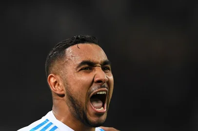 Olympique de Marseilles French forward Dimitri Payet reacts after scoring during the French L1 football match Marseille vs Strasbourg on January 16, 2018 at the Velodrome stadium in Marseille, southern France.  / AFP PHOTO / ANNE-CHRISTINE POUJOULAT