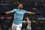 Manchester Citys Argentinian striker Sergio Aguero celebrates after scoring the opening goal of the English Premier League football match between Manchester City and Newcastle United at the Etihad Stadium in Manchester, north west England, on January 20, 2018. / AFP PHOTO / PAUL ELLIS / RESTRICTED TO EDITORIAL USE. No use with unauthorized audio, video, data, fixture lists, club/league logos or live services. Online in-match use limited to 75 images, no video emulation. No use in betting, games or single club/league/player publications.  / 