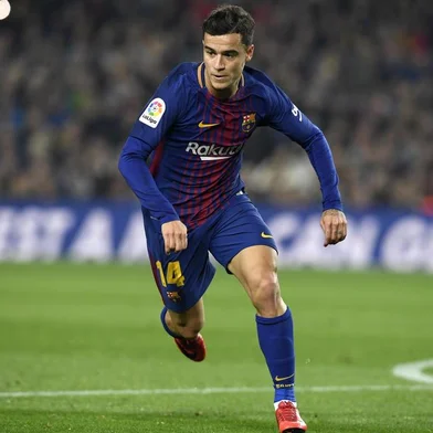 Barcelonas Brazilian midfielder Philippe Coutinho runs during the Spanish Copa del Rey (Kings cup) quarter-final second leg football match between FC Barcelona and RCD Espanyol at the Camp Nou stadium in Barcelona on January 25, 2018.  / AFP PHOTO / LLUIS GENE