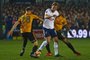 Tottenham Hotspurs English striker Harry Kane (C) vies with Newport Countys English defender Mickey Demetriou (L) and Newport Countys English midfielder Joss Labadie (R) during the English FA Cup fourth round football match between Newport County and Tottenham Hotspur at Rodney Parade in Newport, in south Wales, on January 27, 2018. / AFP PHOTO / Geoff CADDICK / RESTRICTED TO EDITORIAL USE. No use with unauthorized audio, video, data, fixture lists, club/league logos or live services. Online in-match use limited to 75 images, no video emulation. No use in betting, games or single club/league/player publications.  / 