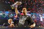 HOUSTON, TX - FEBRUARY 05: Tom Brady #12 of the New England Patriots celebrates with the Vince Lombardi Trophy after defeating the Atlanta Falcons during Super Bowl 51 at NRG Stadium on February 5, 2017 in Houston, Texas. The Patriots defeated the Falcons 34-28.   Kevin C. Cox/Getty Images/AFP