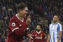 Liverpools Brazilian midfielder Roberto Firmino celebrates scoring their second goal during the English Premier League football match between Huddersfield Town and Liverpool at the John Smiths stadium in Huddersfield, northern England on January 30, 2018. / AFP PHOTO / PAUL ELLIS / RESTRICTED TO EDITORIAL USE. No use with unauthorized audio, video, data, fixture lists, club/league logos or live services. Online in-match use limited to 75 images, no video emulation. No use in betting, games or single club/league/player publications.  / 