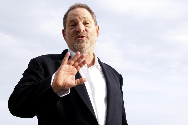(FILES) This file photo taken on October 5, 2015 shows Harvey Weinstein, US film producer and executive producer of the TV series "War and Peace", posing during a photocall at the MIPCOM audiovisual trade fair in Cannes, southeastern France.New York police said on October 12, 2017 they have reopened a investigation into allegations of a 2004 sexual assault by disgraced movie mogul Harvey Weinstein. An avalanche of claims of sexual harassment, assault and rape by the Hollywood heavyweight have surfaced since the publication last week of an explosive New York Times report alleging a history of abusive behavior dating back decades. / AFP PHOTO / VALERY HACHE