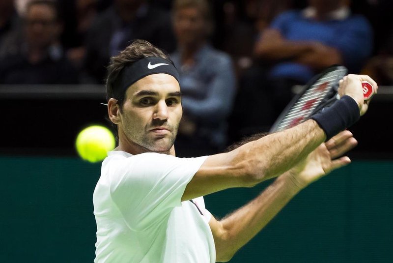 Roger Federer of Switzerland plays a backhand return to Philipp Kohlschreiber of Germany during their second round singles match for the ABN AMRO World Tennis Tournament in Rotterdam on February 15, 2018.  / AFP PHOTO / ANP / Koen Suyk / Netherlands OUT