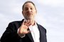 (FILES) This file photo taken on October 5, 2015 shows Harvey Weinstein, US film producer and executive producer of the TV series War and Peace, posing during a photocall at the MIPCOM audiovisual trade fair in Cannes, southeastern France.New York police said on October 12, 2017 they have reopened a investigation into allegations of a 2004 sexual assault by disgraced movie mogul Harvey Weinstein. An avalanche of claims of sexual harassment, assault and rape by the Hollywood heavyweight have surfaced since the publication last week of an explosive New York Times report alleging a history of abusive behavior dating back decades. / AFP PHOTO / VALERY HACHE