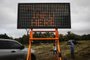 PAHOA, HI - MAY 05: A sign reads Eruption Info Here at a roadblock near volcanic activity on Hawaiis Big Island on May 5, 2018 in Pahoa, Hawaii. A magnitude 6.9 earthquake struck the island May 4 along with new eruptions from the Kilauea volcano. The volcano has spewed lava and high levels of sulfur gas into two nearby communities, leading officials to order 1,700 to evacuate in the area.   Mario Tama/Getty Images/AFP