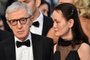  FILES - A picture taken on May 15, 2015 shows US director Woody Allen (L) and his wife Soon-Yi arriving for the screening of the film Irrational Man at the 68th Cannes Film Festival in Cannes, southeastern France. Allen has given a rare interview and made even rarer remarks about his controversial marriage to the adopted daughter of his former girlfriend. Im 35 years older and somehow, through no fault of mine or hers, the dynamic worked, he told National Public Radio of his wife Soon-Yi, calling him paternal in their relationship. AFP PHOTO / BERTRAND LANGLOISEditoria: ACELocal: CannesIndexador: BERTRAND LANGLOISSecao: CinemaFonte: AFPFotógrafo: STF