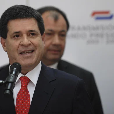 Paraguayan president elect Horacio Cartes speaks during the  introduction  of his ministers on August 12, 2013 in Asuncion.  Cartes takes up office as Paraguayan president on August 15. AFP PHOTO/NORBERTO DUARTE