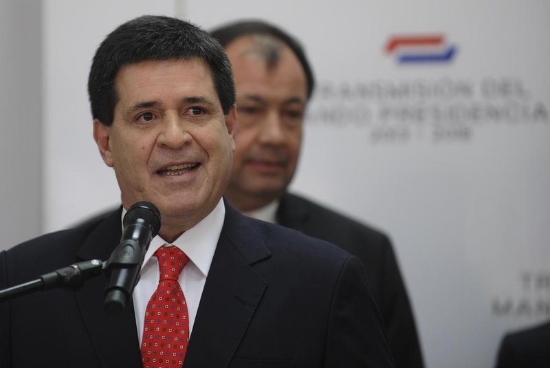 Paraguayan president elect Horacio Cartes speaks during the  introduction  of his ministers on August 12, 2013 in Asuncion.  Cartes takes up office as Paraguayan president on August 15. AFP PHOTO/NORBERTO DUARTE