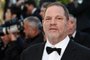 (FILES) This file photo taken on May 22, 2015 shows US producer Harvey Weinstein arriving for the screening of the film The Little Prince at the 68th Cannes Film Festival in Cannes.    Weinstein was fired from his film studio the Weinstein Company on October 8, 2017, following reports that he sexually harassed women over several decades, according to US media. / AFP PHOTO / LOIC VENANCE