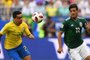  Brazil's defender Fagner (L) eyes the ball as he vies for it with Mexico's forward Carlos Vela (R) during the Russia 2018 World Cup round of 16 football match between Brazil and Mexico at the Samara Arena in Samara on July 2, 2018. / AFP PHOTO / MANAN VATSYAYANA / RESTRICTED TO EDITORIAL USE - NO MOBILE PUSH ALERTS/DOWNLOADSEditoria: SPOLocal: SamaraIndexador: MANAN VATSYAYANASecao: soccerFonte: AFPFotógrafo: STF