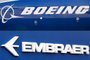 -(FILES) This file photo composition created on December 21, 2017  shows the Boeing logo on the fuselage of a Boeing 787-10 Dreamliner test plane presented on the tarmac of Le Bourget airport near Paris on June 18, 2017, and the logo of Brazils aircraft manufacturer Embraer also taken at Le Bourget airport, on June 23, 2013.On February 2, 2018 Embraer stocks rose almost 5% on the Sao Paulo Stock Exchange, following the leaking of a possible agreement between the Brazilian aircraft manufacturer and the US company Boeing for the joint development of commercial aircrafts. / AFP PHOTO / ERIC PIERMONTEditoria: FINLocal: Le BourgetIndexador: ERIC PIERMONTSecao: merger, acquisition and takeoverFonte: AFPFotógrafo: STF