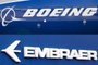 -(FILES) This file photo composition created on December 21, 2017  shows the Boeing logo on the fuselage of a Boeing 787-10 Dreamliner test plane presented on the tarmac of Le Bourget airport near Paris on June 18, 2017, and the logo of Brazils aircraft manufacturer Embraer also taken at Le Bourget airport, on June 23, 2013.On February 2, 2018 Embraer stocks rose almost 5% on the Sao Paulo Stock Exchange, following the leaking of a possible agreement between the Brazilian aircraft manufacturer and the US company Boeing for the joint development of commercial aircrafts. / AFP PHOTO / ERIC PIERMONTEditoria: FINLocal: Le BourgetIndexador: ERIC PIERMONTSecao: merger, acquisition and takeoverFonte: AFPFotógrafo: STF