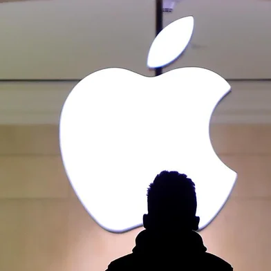 A man walks up the stairs at the Apple Store in Grand Central Station February 25, 2016. Apple has been in a legal fight with the government in the San Bernardino case, where the FBI wants the company to help hacking the iPhone of Syed Farook, a US citizen, who gunned down 14 people with his Pakistani wife Tashfeen Malik in the California city in December.Timothy A. CLARY / AFP