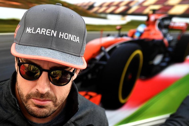 (FILES) In this file photo taken on April 27, 2017 McLarens Spanish driver Fernando Alonso answers journalists questions in the paddock at the Sochi Autodrom circuit in Sochi on April 27, 2017.Fernando Alonso will retire from Formula 1 at the end of the season McLaren announced on August 14, 2018. / AFP PHOTO / ANDREJ ISAKOVIC